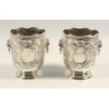 Pair of late Victorian silver vases, each with chased and embossed floral and scroll decoration, 2