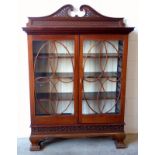 An Edwardian mahogany satinwood and box wood line inlaid bookcase, the top with pierced swan neck