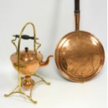 An early 20th century hammered copper and brass kettle on stand with burner, stamped and engraved