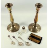 Pair of Sterling silver candlesticks with urn shaped scones stamped ?Sterling? (loaded) H. 22cm