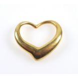 Tiffany & Co yellow metal open heart by Peretti, stamped 18K, 3.5 x 3.1cm, 10.9grs