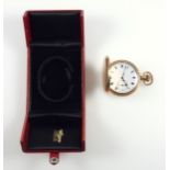 Hunting watch with a circular white enamelled dial, seconds dial and black Roman numerals