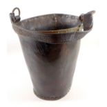 Antique riveted leather fire bucket with copper rim and leather handle, H. 28 cm to rim
