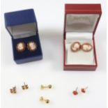 Pair of 9ct. gold shell cameo stud earrings with a decafoil border, another pair of cameo