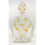 A modern Art Deco style clear and frosted glass, amber tinted decanter and stopper, 27 cm high