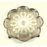 Victorian silver salver of octo-foil form, with a pierced and beaded border on four scrolled feet,
