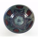 Alan Caiger-Smith (1930-2020), a blue and red lustre pottery bowl with alternating panel of