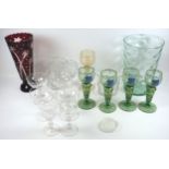 A German glass roemmer, four Continental green glass hock type glasses, a flash cut ruby glass vase,