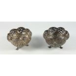 Pair of Indian/Burmese silver hexafoil bowls, each with pierced scrolling floral decoration, on 3