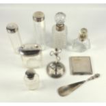 Three silver topped bottles by N Bros, Birmingham 1911, 3 silver mounted scent bottles, manicure