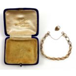 9ct gold child's bracelet with a padlock clasp, cased, 6 grams