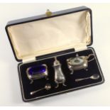 George V silver 3 piece cruet set of moulded rounded rectangular form, comprising a mustard pot,