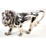 Near Eastern white metal model of a lion, standing, bears marks and stamped 925, W. 23.5cm, 591