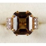 9ct. gold ring set emerald cut smoky quartz with diamond set shoulders, by D K, Birmingham 2006, 4.