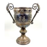 Two Edwardian silver cycling sporting cups, each embossed with 2 cyclists and inscriptions, with 2
