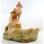 A 'Royal Dux' hand-painted porcelain figure, depicting a water maiden overlooking a pond. Marked