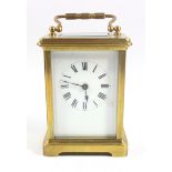 Early 20th century French carriage timepiece with a white enamelled dial, black Roman numerals,
