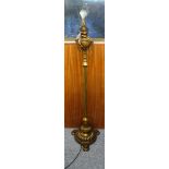 Edwardian brass standard oil lamp with a reeded column, on a gadrooned circular base, 3 circular