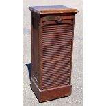 1920?s oak tambour fronted filing cabinet fitted with nine shelves, bearing brass presentation