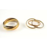 Yellow and white metal Russian style wedding ring inscribed “John”, and a similar smaller ring, 15.