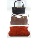 Crocodile skin effect brown leather hand bag, a black leather gilt metal ladies hand bag with