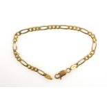 Foreign yellow metal flat curb link bracelet stamped “750”, L 20cm, 8.6grs