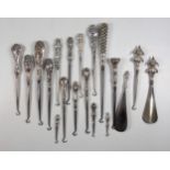 Collection of 14 late Victorian and later silver handled button hooks including one with a double