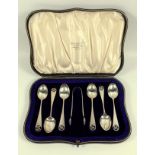 Unusual George V set of 6 silver coffee spoons, each with a pierced swastika handle, and a pair of
