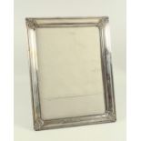 Peruvian white metal mounted rectangular photograph frame with floral corners, stamped “925”, 26.8 x