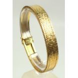Foreign yellow metal textured bracelet, stamped “585”, 18.7 x 1.2cm, 36.3grs