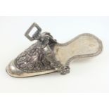 South American ladies white metal stirrup in the form of a shoe, embossed with 2 exotic birds, fruit