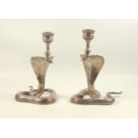 Pair of late 19th century Indian silver candlesticks, each modelled as a Cobra with monkey mask