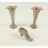 Pair of late Victorian trumpet shaped vases, each with embossed floral decoration, on a gadrooned