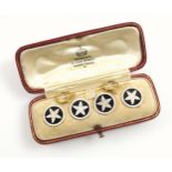 18ct gold gentleman's set of four shirt studs, with an enamelled floral design, set in a red leather