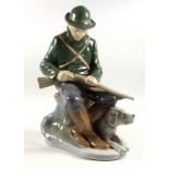 Royal Copenhagen figurine 1087 of a hunter and dog. 22cm tall