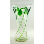 A Late 19th/early 20th century Continental clear glass waisted vase, overlaid in green with swirling