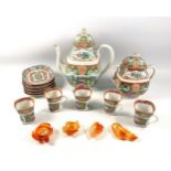 20th century Chinese famille rose tea set, painted with "shou" symbols, butterflies, birds, floral