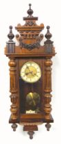 A Viennese style regulator with an 8 day striking movement in a stained beech case, 94 cm long