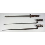 Two socket bayonets, one for a "Brown Bess", the other for an Enfield musket c.1850s, both 52cm, and