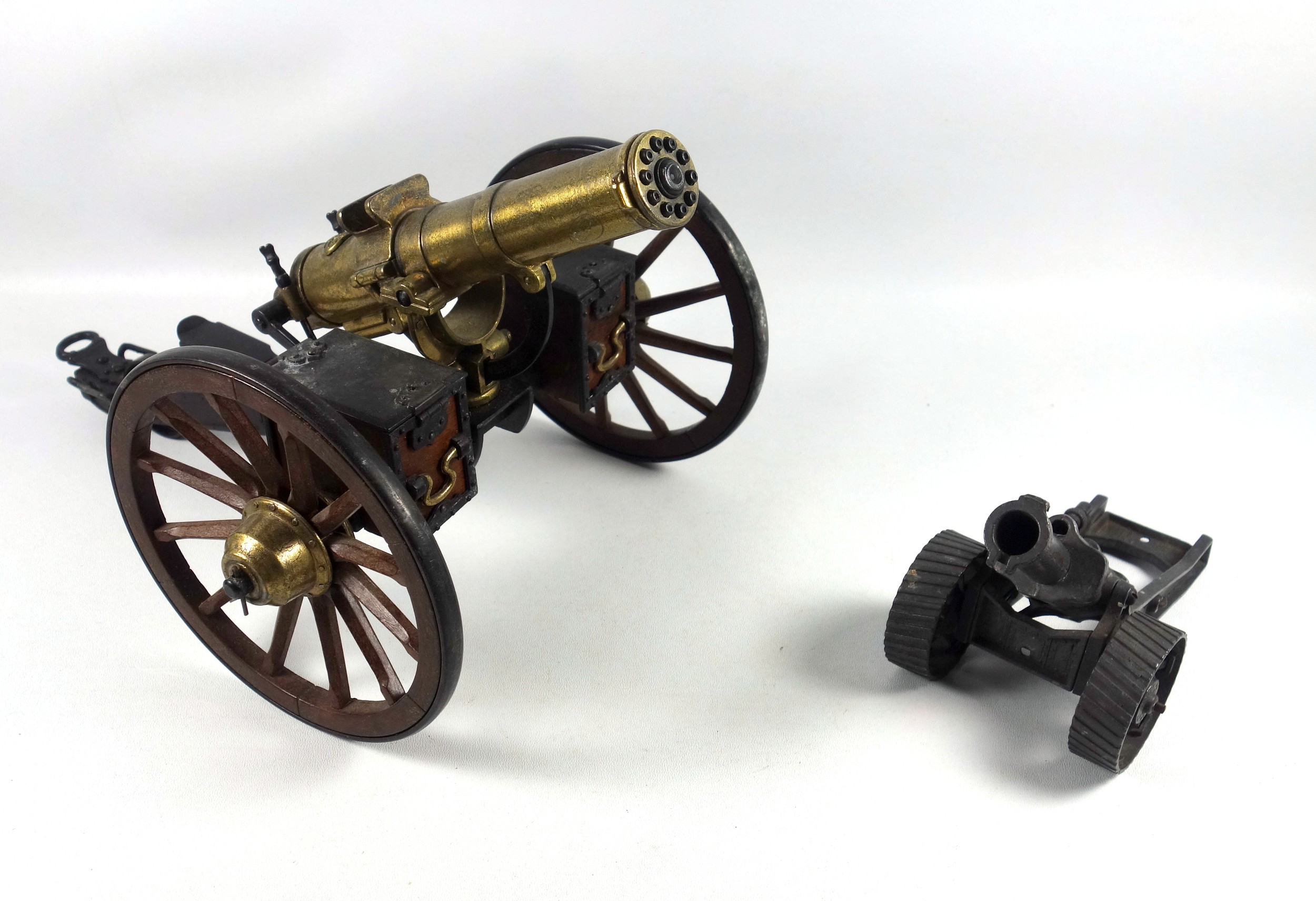 Desktop model of a Gatling field gun, the brass barrel with turning mechanism mimicking firing
