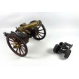 Desktop model of a Gatling field gun, the brass barrel with turning mechanism mimicking firing