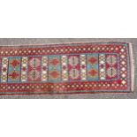 Persian runner, the madder field with stylised floral decoration, 315 x 82.5cm