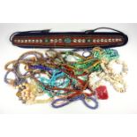 Venetian glass bead necklaces, other bead necklaces, shell necklace, and a shell and bead belt on