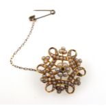 Edwardian 15ct gold floral openwork brooch set seed pearls and diamonds, W.2.5cm, gross 6.5grs