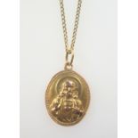 9ct gold fine curb-link necklace with a religious pendant, 6.3grs