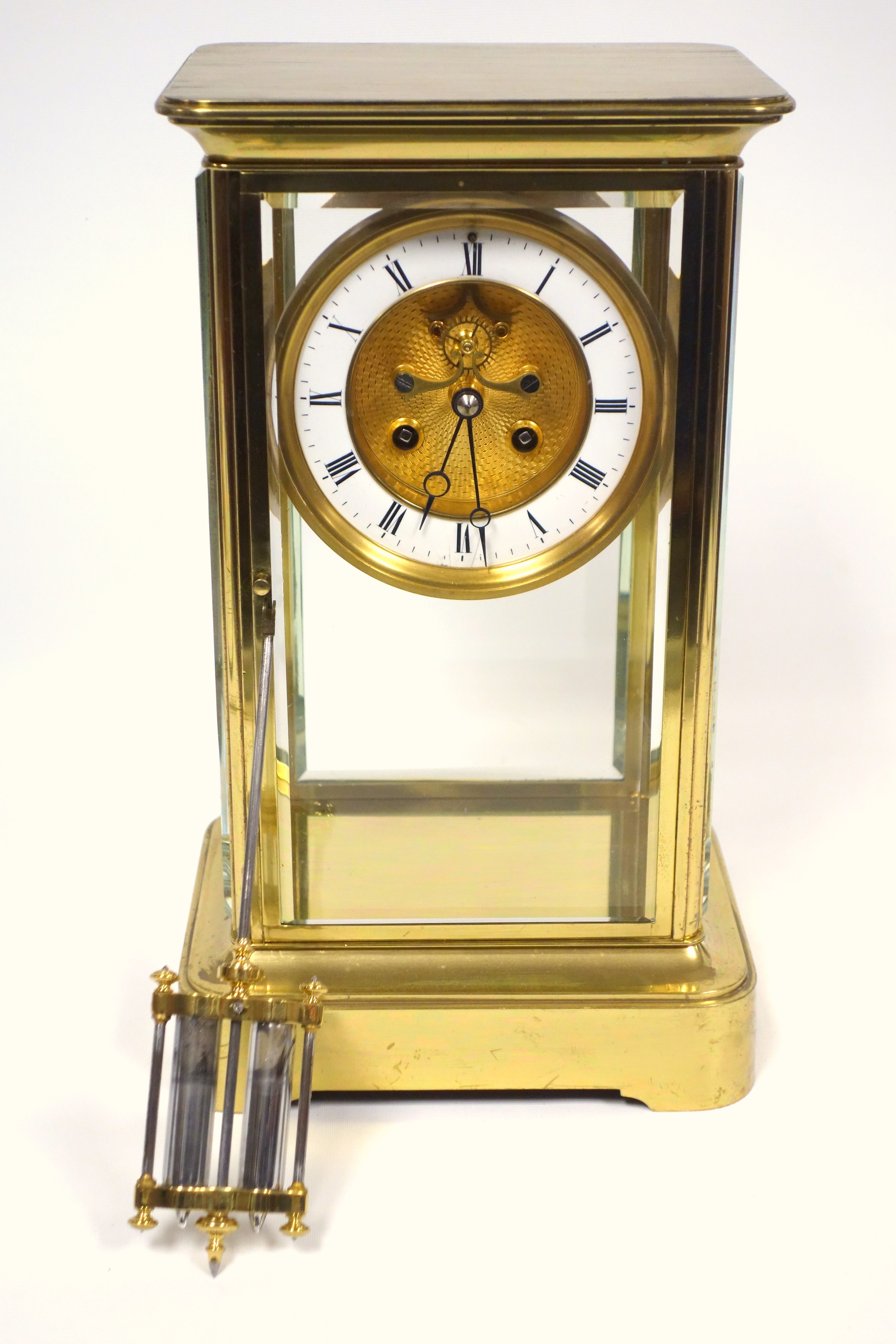 Late 19th century 4-glass clock with a gilt circular dial with visible escapement, white enamelled