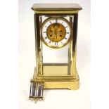 Late 19th century 4-glass clock with a gilt circular dial with visible escapement, white enamelled