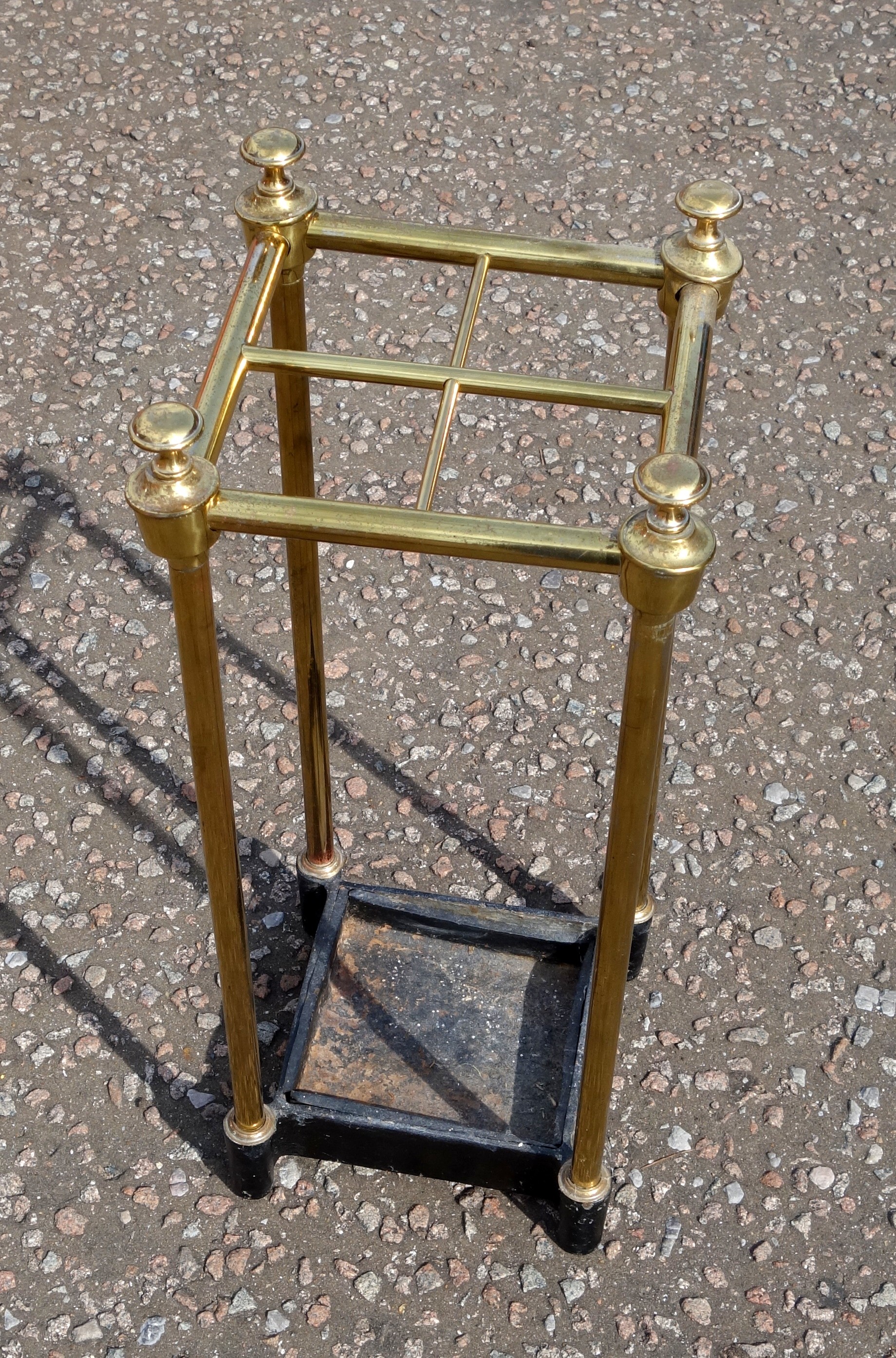 Victorian brass stick stand with grid top of 4 divisions and finials, set on a cast iron drip tray - Image 2 of 2