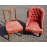 Victorian nursing chair with a buttoned back, upholstered in red fabric, on turned tapering legs,