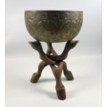 Himalayan brass singing bowl, decorated with dancing figures 17cm diameter x 9cm , with an